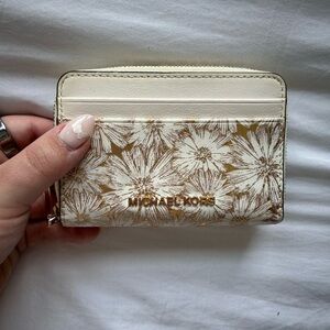 Never used Micheal Kors Small gold and white flower wallet